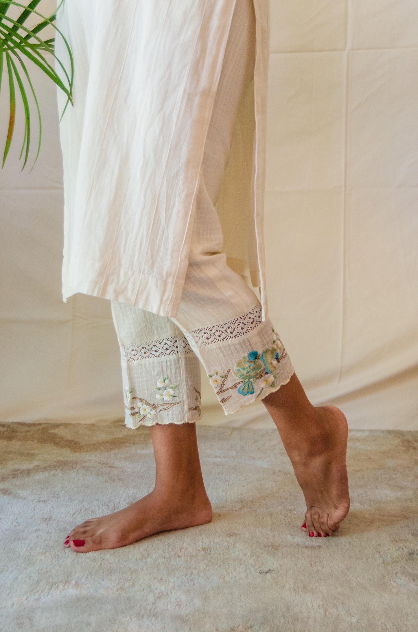 Cream Kurta Set paired with Blue Bird embroidered pants