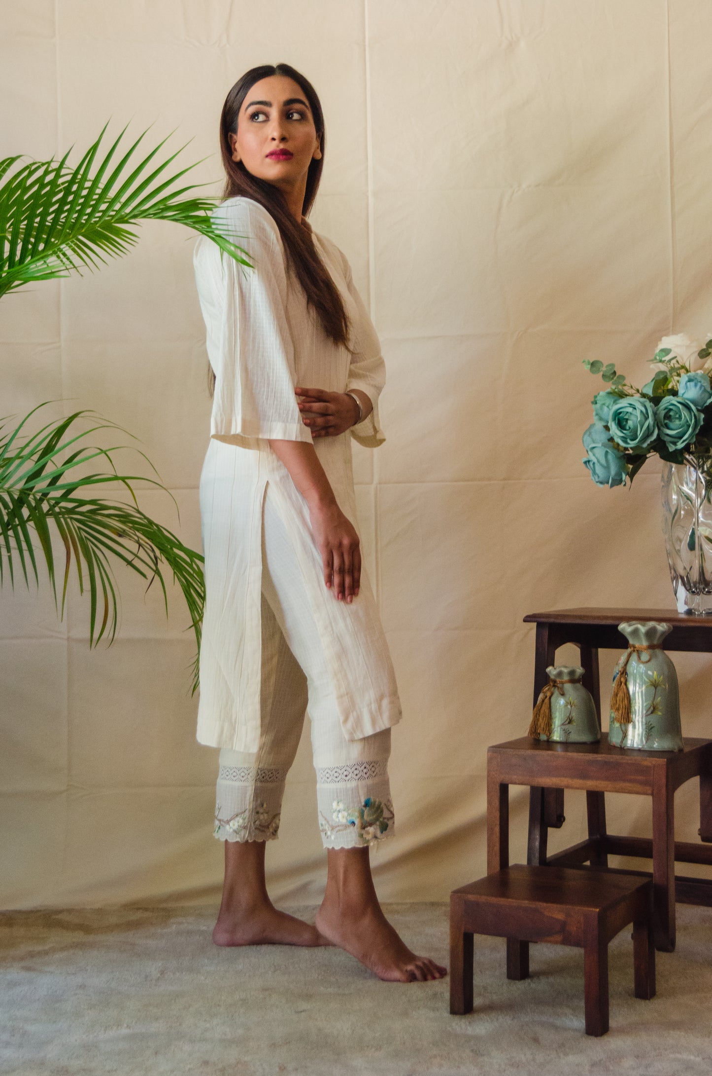 Cream Kurta Set paired with Blue Bird embroidered pants